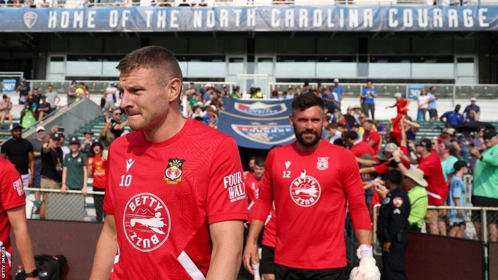 Paul Mullin and Ben Foster walk out at WakeMed Soccer Park