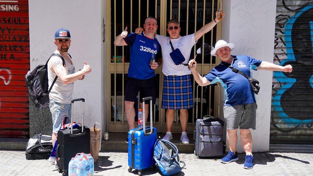 Rangers fans outside a Seville apartment