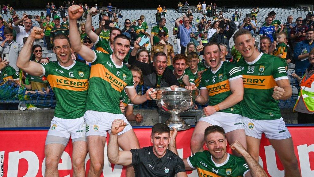 The Kerry players celebrate with the Sam Maguire Cup in 2022