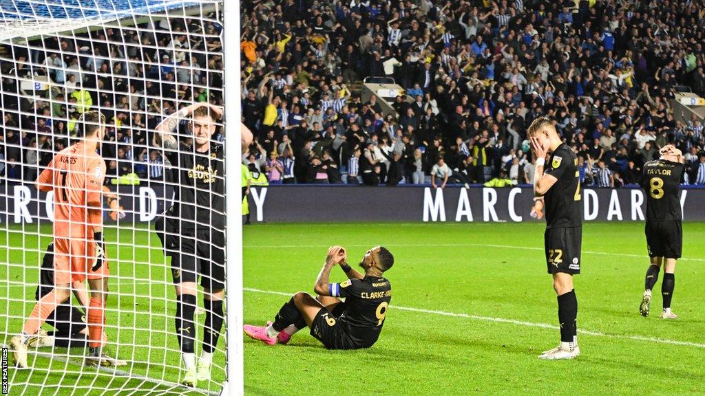 Peterborough united players left dejected