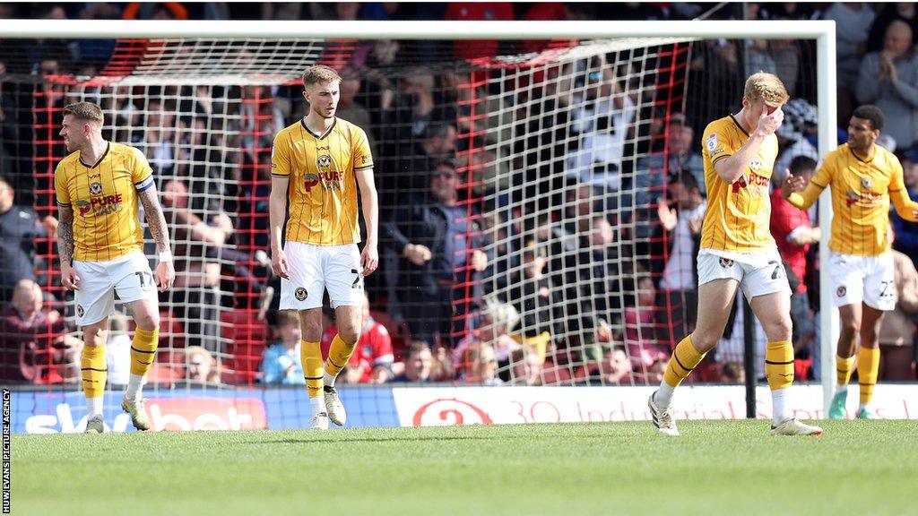 Newport players look disconsolate after conceding at Grimsby