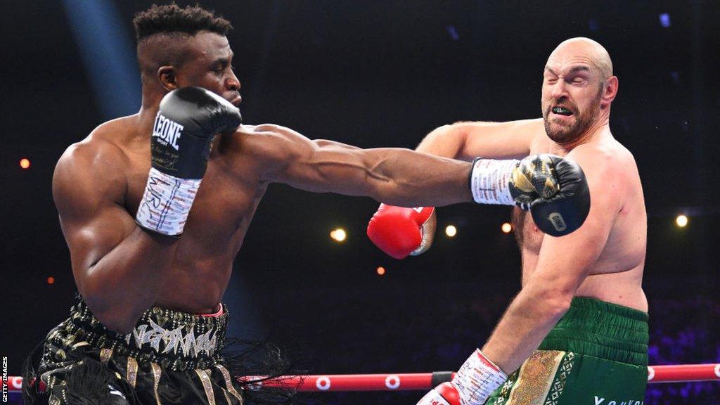 Francis Ngannou throws a punch at Tyson Fury