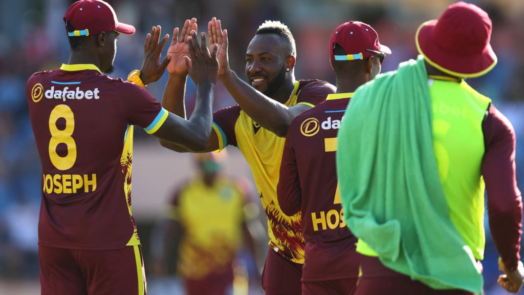 West Indies players celebrate a wicket