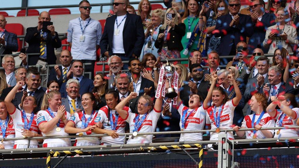 St Helens players lift the Challenge Cup