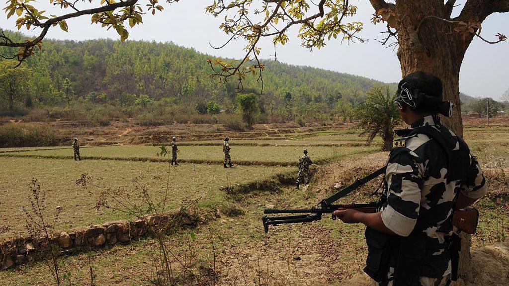 Security forces deployed to ensure peaceful polling during the first phase of West Bengal assembly elections in April 2016 in Purulia district, India. The village is surrounded by hills from all sides and has been a Maoist stronghold since 2000. 