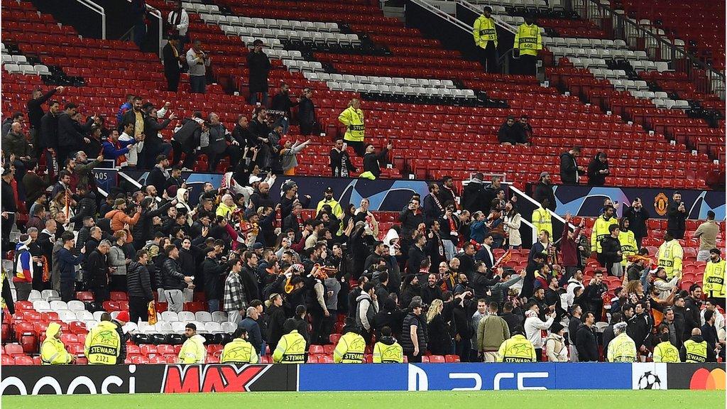 Galatasaray fans celebrate as their side beat Manchester United