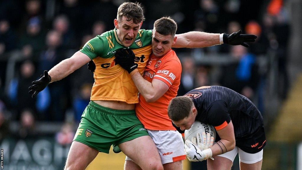 Donegal's Hugh McFadden battles with Armagh's Greg McCabe and Blaine Hughes last month at the Athletic Grounds