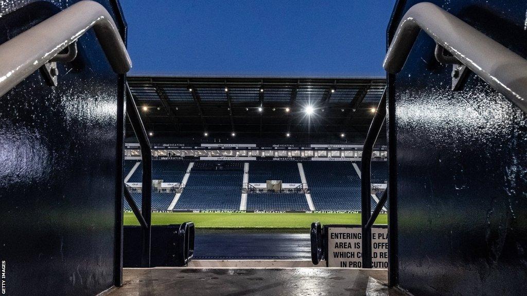 Hawthorns Stadium, home of West Brom, with a view from the concourse steps out onto the stand and pitch