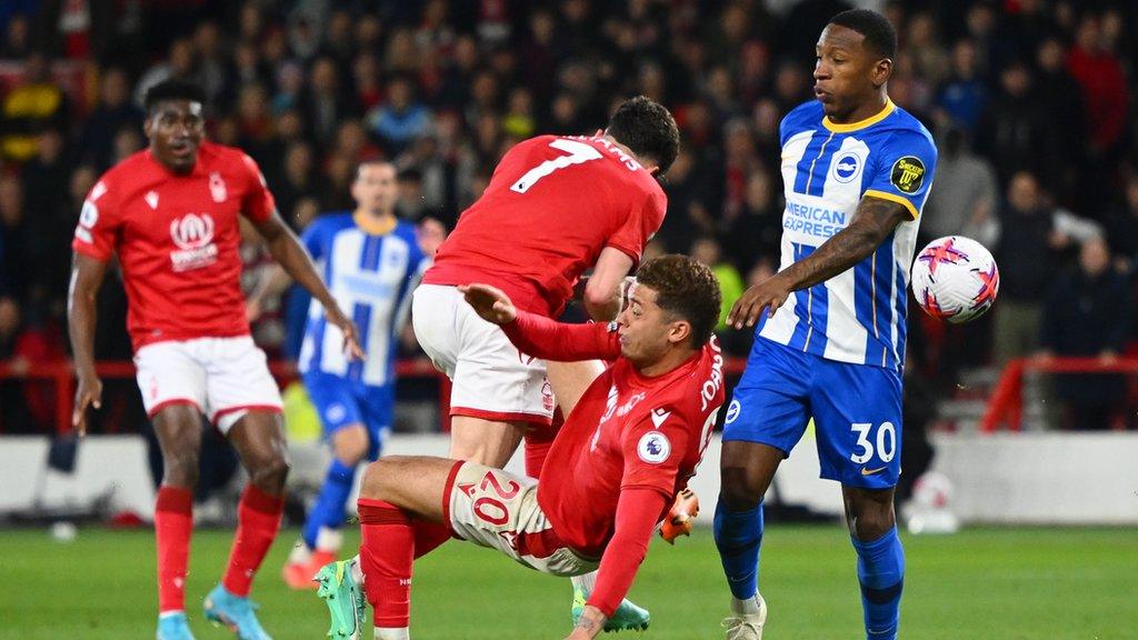 Teammates Brennan Johnson of Nottingham Forest and Neco Williams clash during the Premier League match between Nottingham Forest and Brighton & Hove Albion