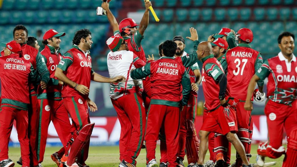 Oman's players celebrate