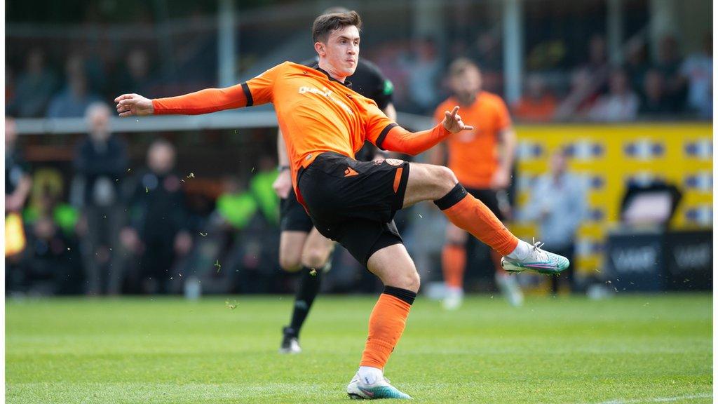 Jamie McGrath slices his shot into the bottom corner