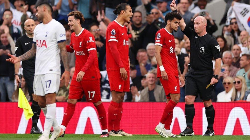 Curtis Jones and Liverpool players react to Jones being shown a red card against Tottenham