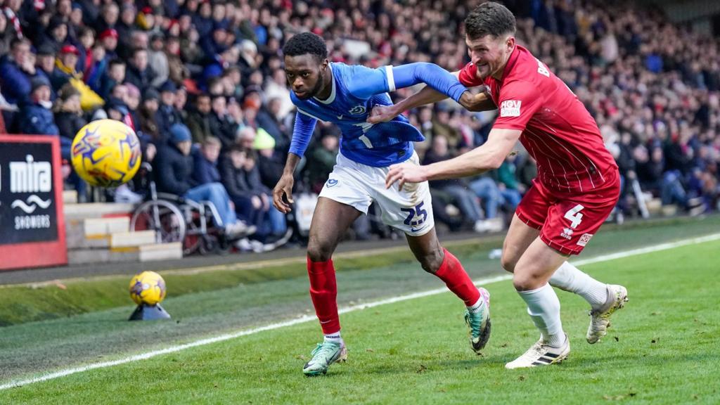 Cheltenham Town and Portsmouth in action