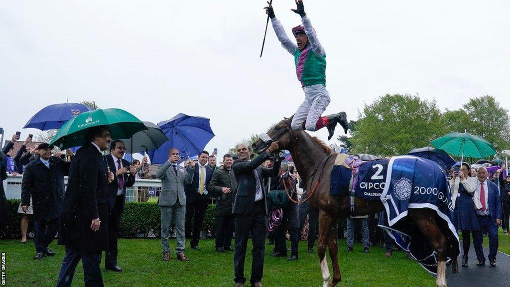 Frankie Dettori dismounts Chaldean in his trademark celebration after winning the 2,000 Guineas at Newmarket