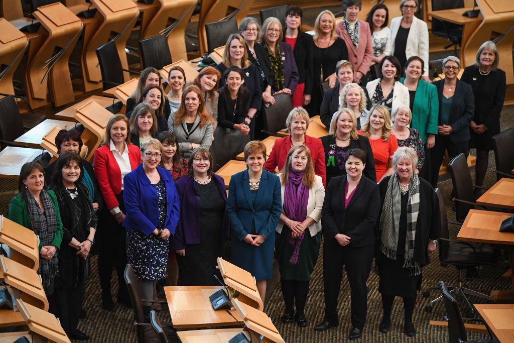 Women MSPs in Scottish Parliament debating chamber