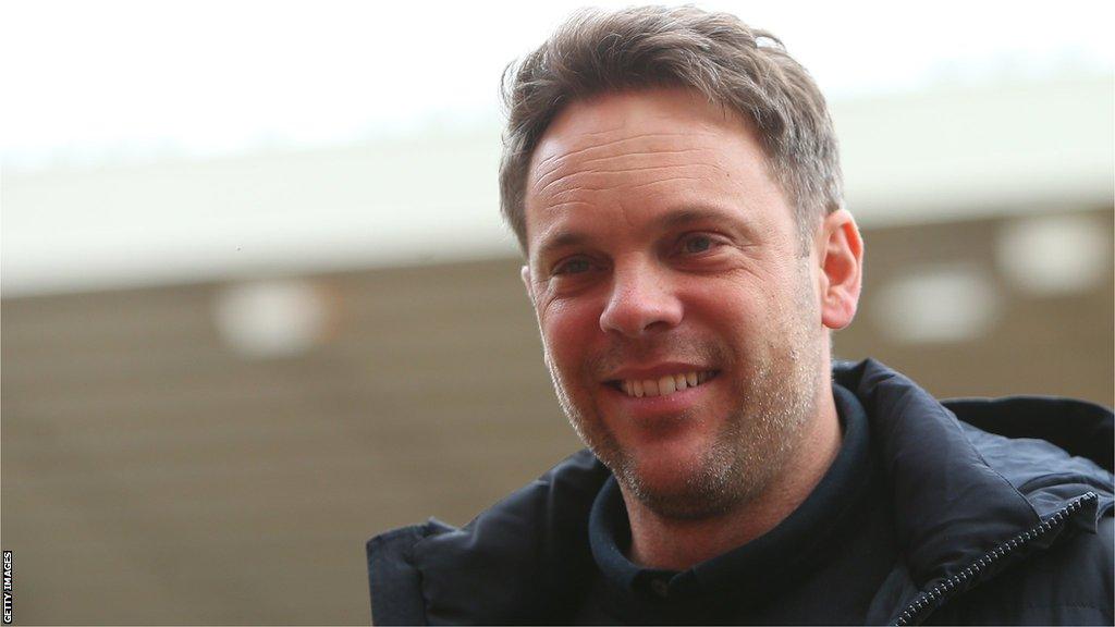 Kristjaan Speakman smiles as he arrives at Sunderland's Stadium of Light