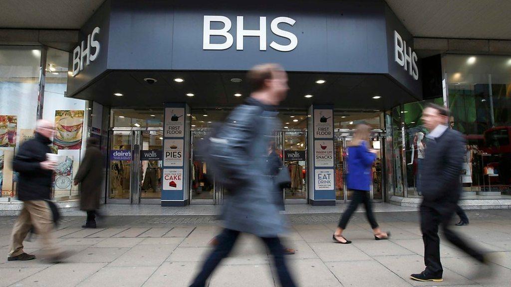 Shoppers walk past BHS