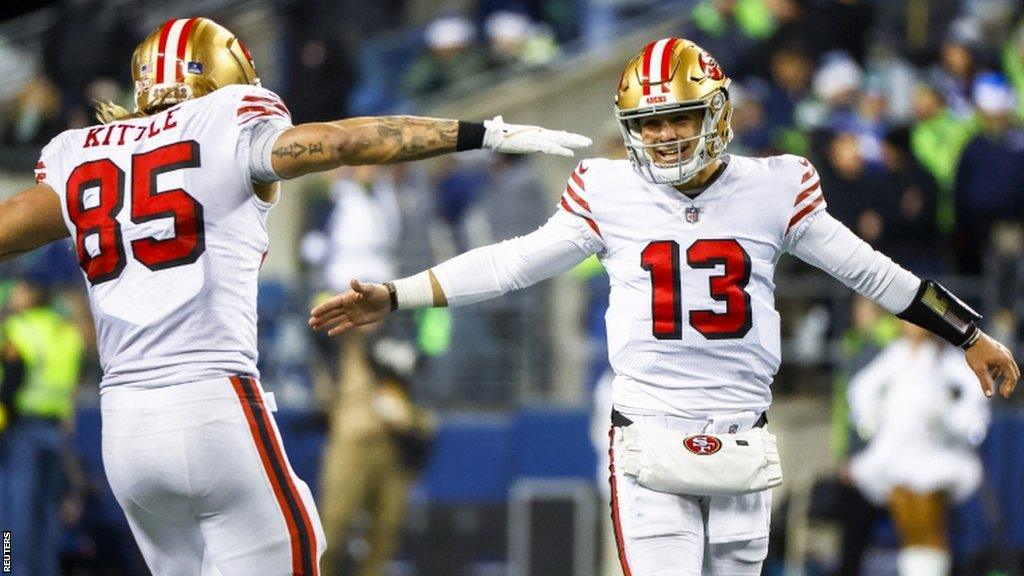 George Kittle celebrates with Brock Purdy