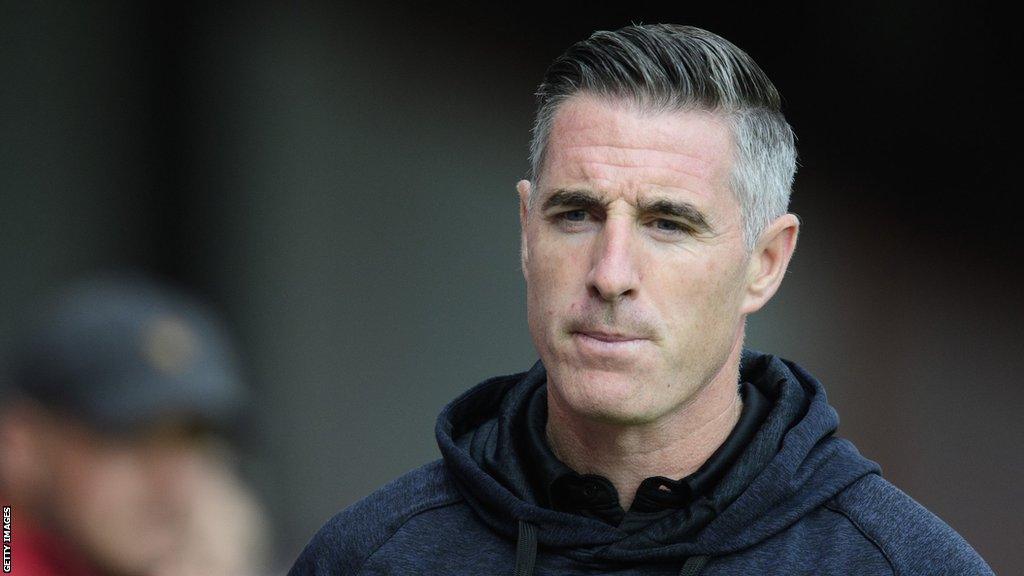 Mark Kennedy stalks the touchline in Lincoln's friendly with Grimsby