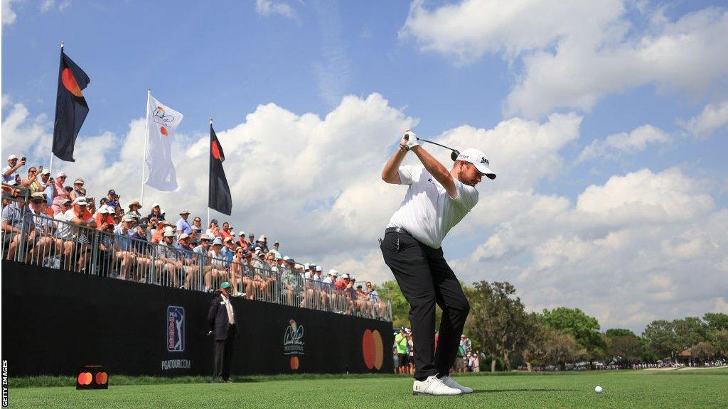 Shane Lowry swings at the ball