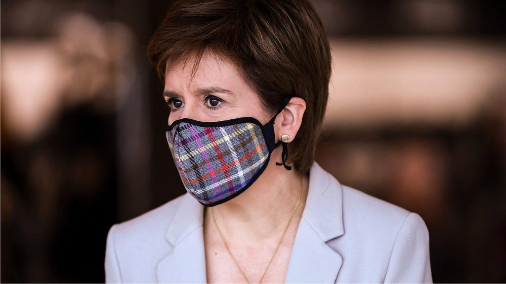 First Minister Nicola Sturgeon, wearing a Tartan face mask during a visit to New Look at Ford Kinaird Retail Park in Edinburgh.