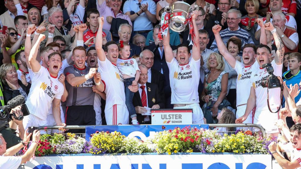 Tyrone players celebrate as captain Sean Cavanagh lifts the Anglo Celt Cup