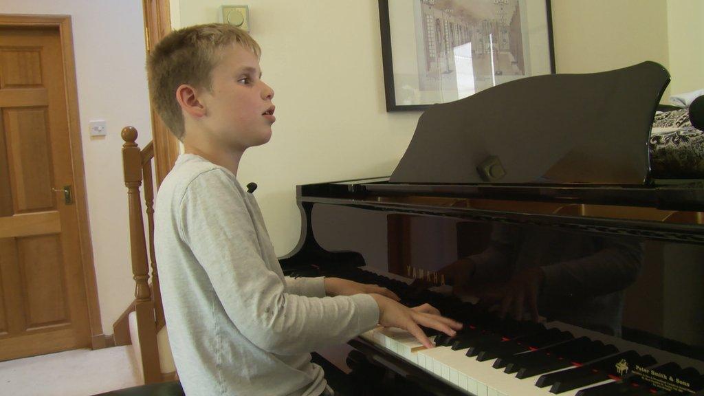 Ethan Loch playing the piano