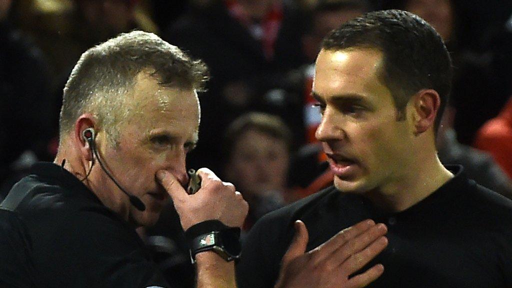 Referee Jon Moss (left) and assistant Eddie Smart