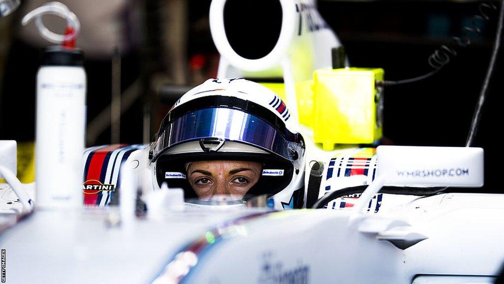 Susie Wolff sits in the cockpit of a Williams F1 car at the 2014 British Grand Prix