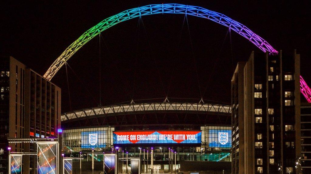 The Wembley arch lit up in rainbow colours