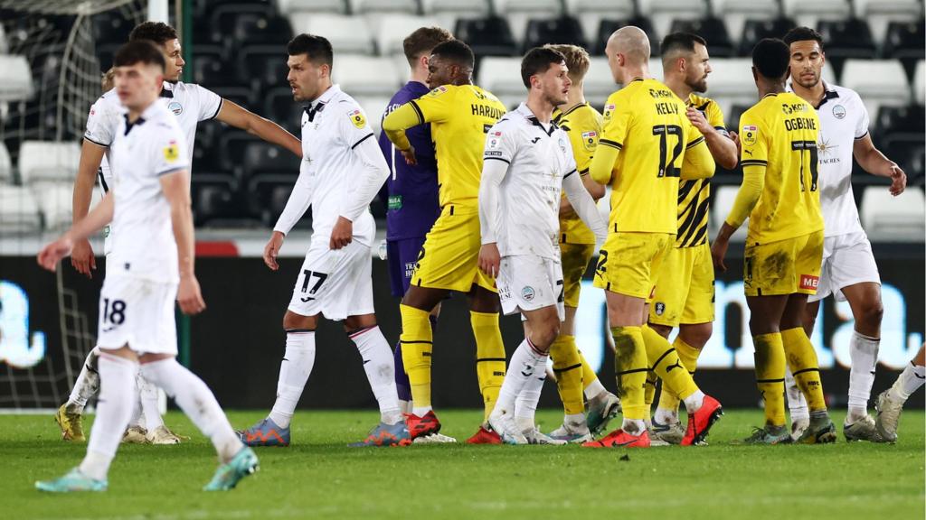 Swansea and Rotherham players shake hands