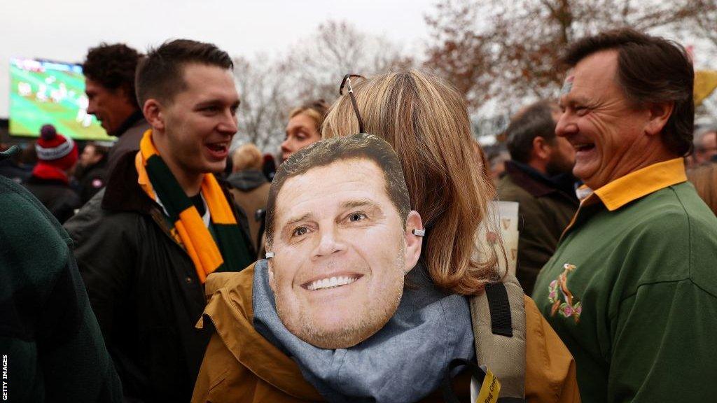 A fan wearing a Rassie Erasmus mask at Twickenham in 2021