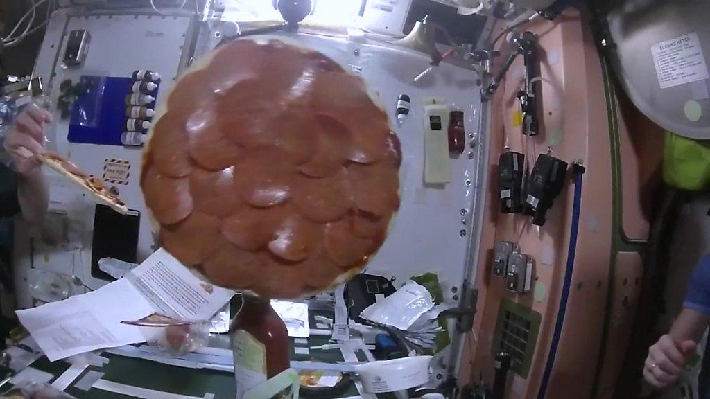 "Flying saucers of the edible kind." it's the first pizza party in space