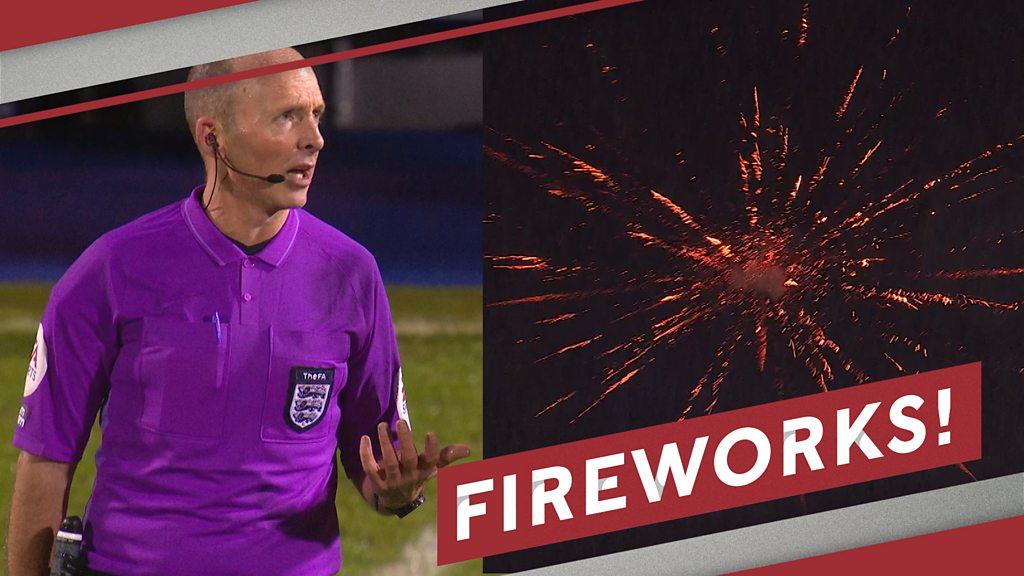 Mike Dean watches fireworks at Edgeley Park