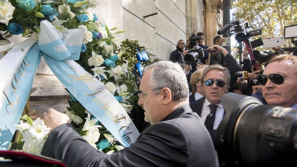 Lazio Chairman Claudio Lotito puts a flower wreath at the synagogue in Rome