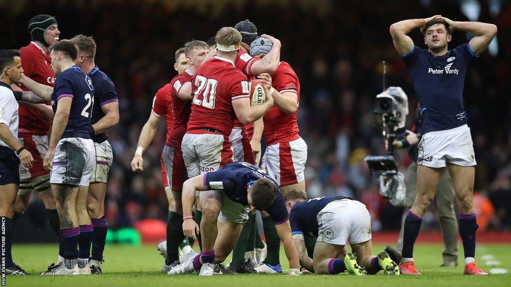 Wales players celebrate an 11th successive win against Scotland in Cardiff
