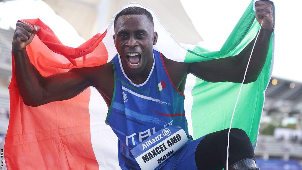 Italian sprinter Maxcel Amo Manu celebrates his gold medal