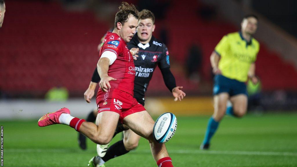 Ioan Lloyd, who has played two internationals for Wales, clears his lines against Lions