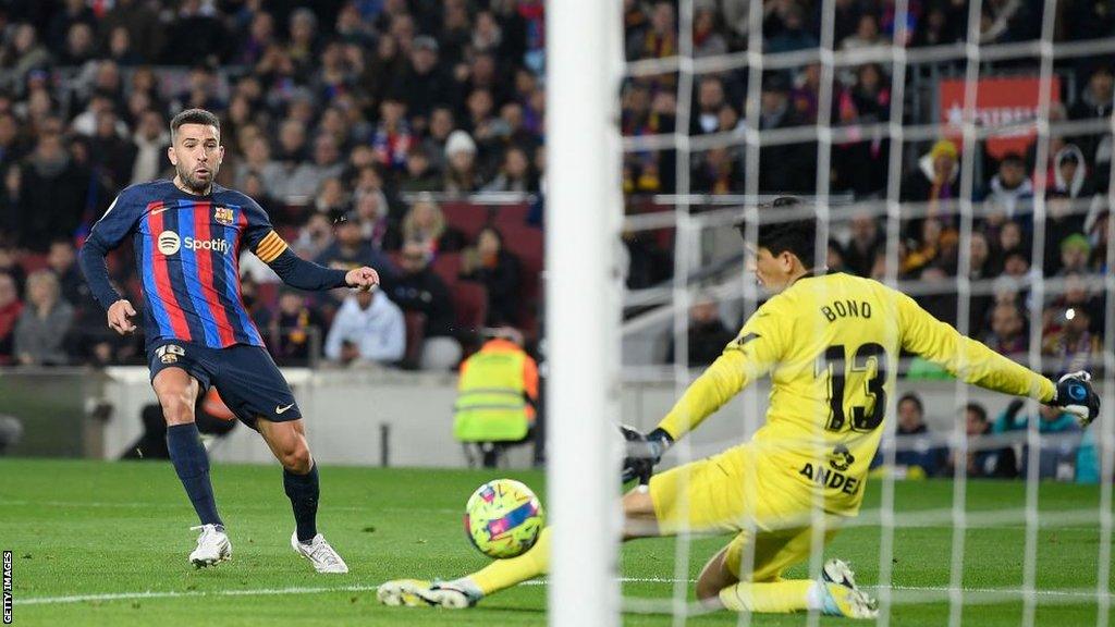 Jordi Alba of Barcelona scores