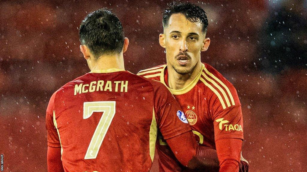 Aberdeen's Bojan Miovski celebrates scoring to make it 1-1 with his teammate Jamie McGrath during a cinch Premiership match between Aberdeen and Heart of Midlothian at Pittodrie Stadium