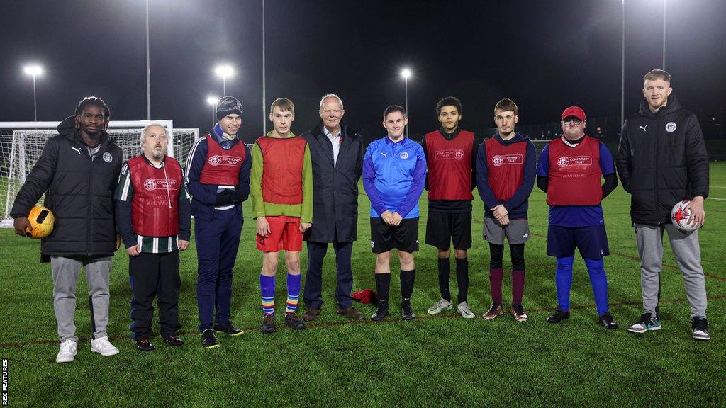 Wigan players Baba Adeeko (far left) and Liam Morrison (far right) at the Every Player Counts event with EFL chief executive Trevor Birch (centre)