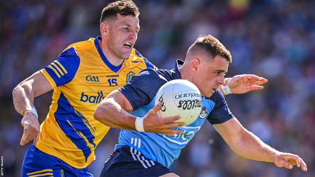 Dublin's Brian Howard is challenged by Roscommon's Diarmuid Murtaugh