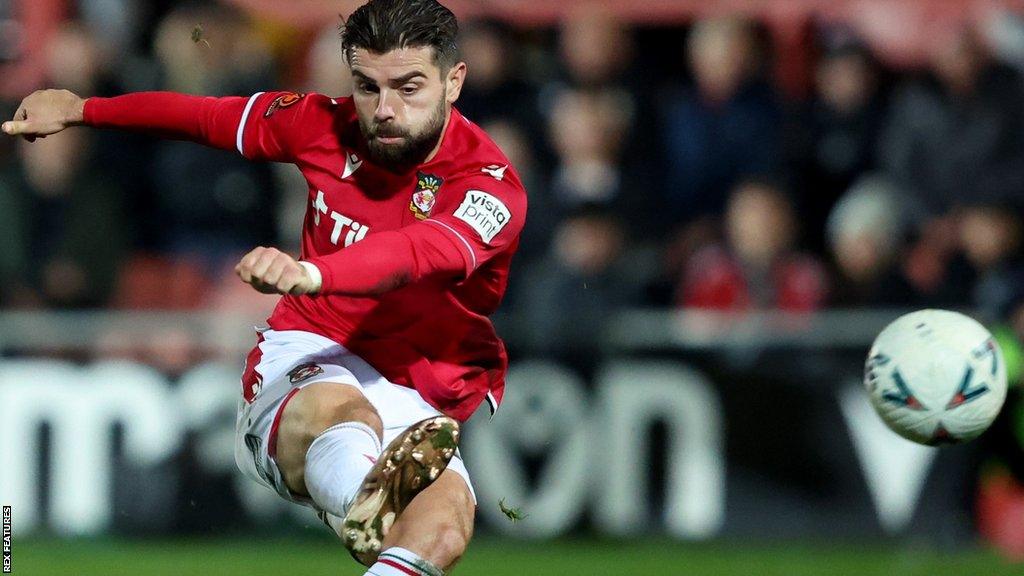 Wrexham's Elliot Lee scores his side's second goal against Farnborough