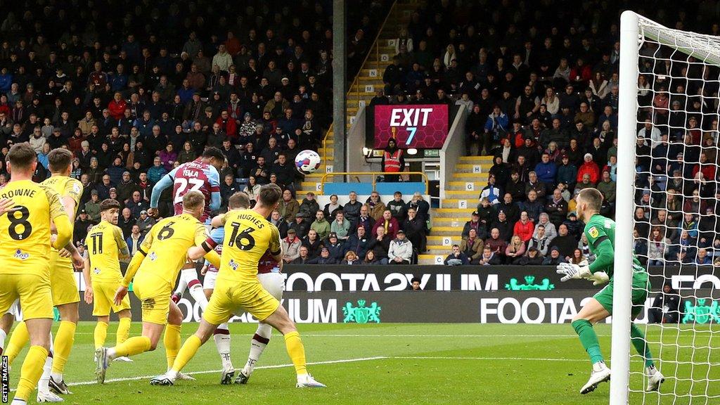 Burney's Nathan Tella scores in the first half against Preston