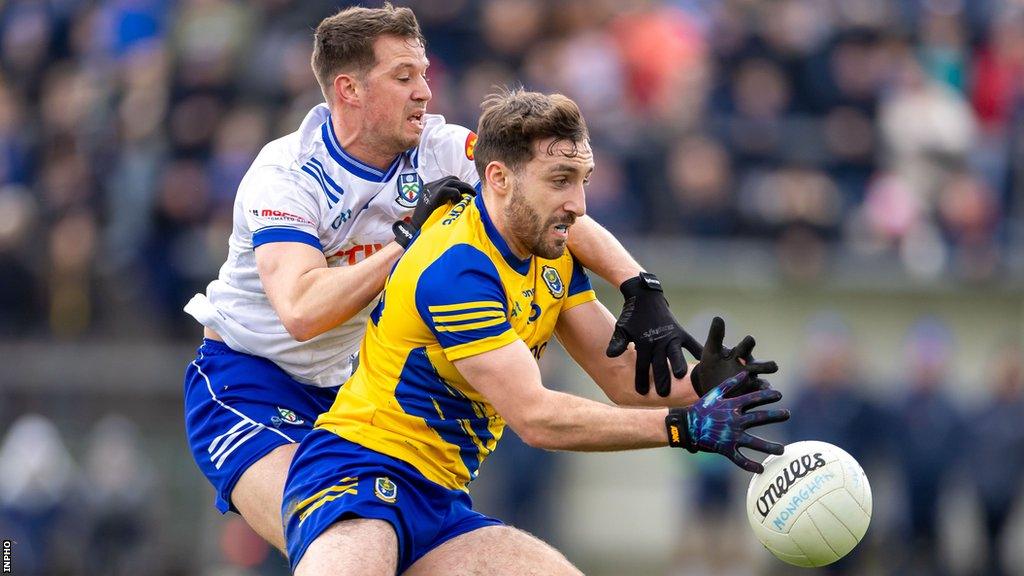 Roscommon's James Burke is challenged by Monaghan's Ryan Wylie