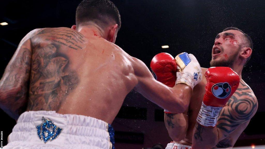 Joe Cordina punching Shavkatdzhon Rakhimov