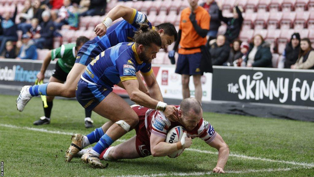 Liam Marshall scores a try for Wigan Warriors against Wakefield Trinity