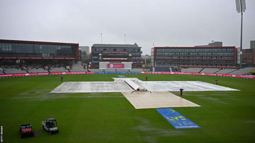 The covers came on at a wet Old Trafford