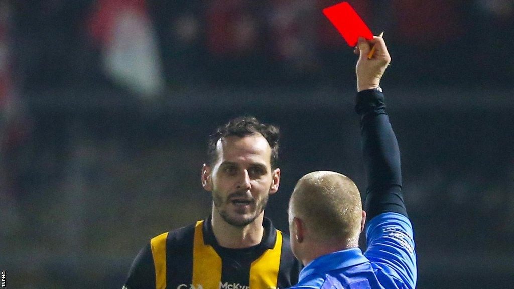 Referee Barry Cassidy red cards Crossmaglen captain Jamie Clarke in in the closing stages of the game at Healy Park