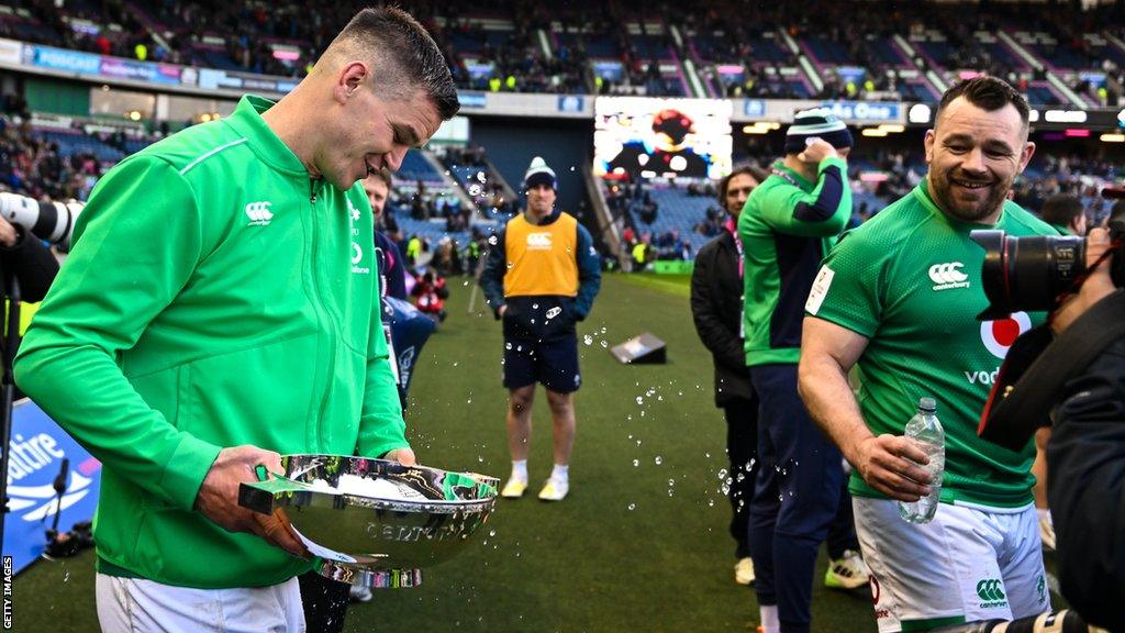 Cian Healy throws water in Johnny Sexton's direction following the post-match presentation after Ireland's win over Scotland on Sunday